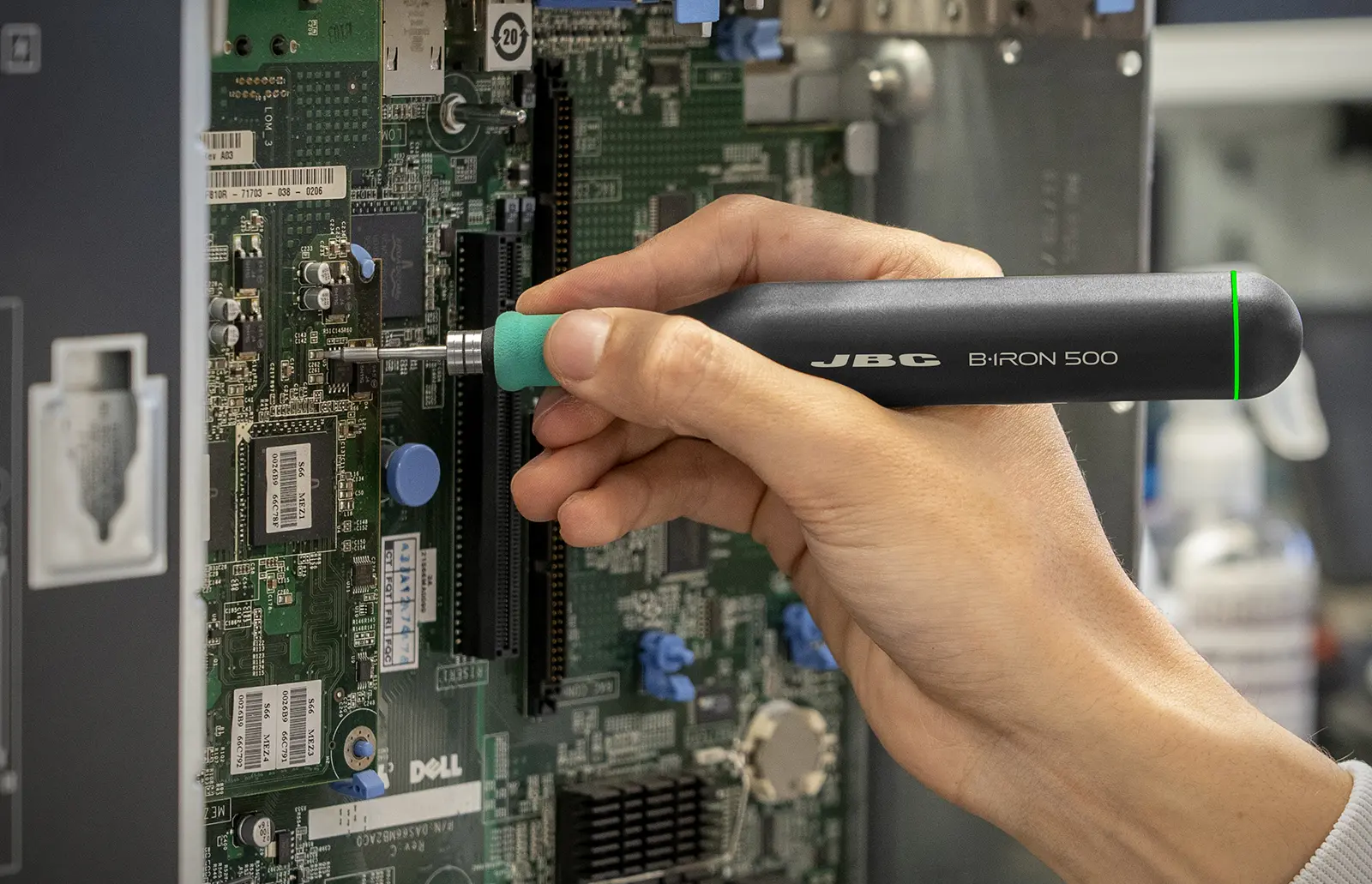 B.IRON being used to repair a mounted PCB